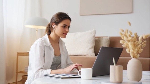 woman video conference laptop